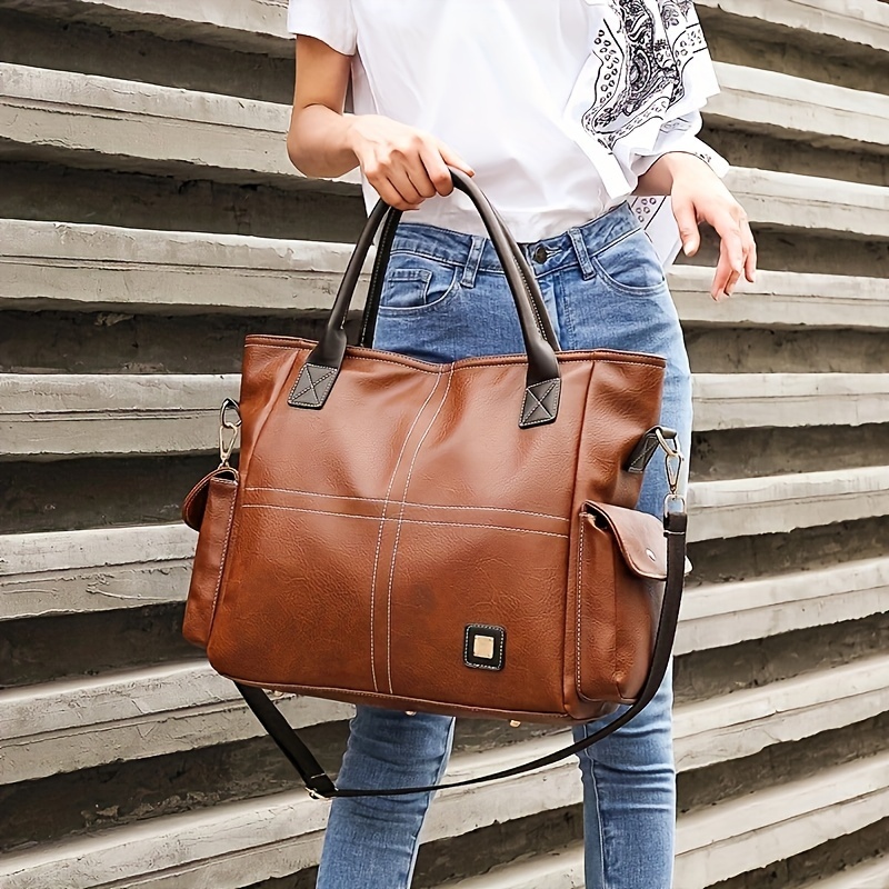 Navy tote bag with brown clearance handles