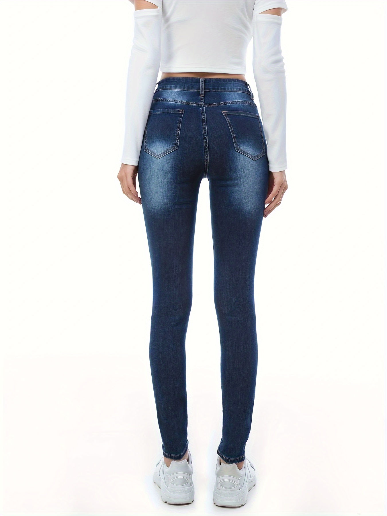 Calça jeans skiny cintura alta detalhes rasgado bolsa funcional
