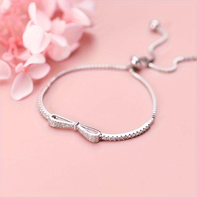 Sterling Silver Bow Bracelet CZ December Birthstone