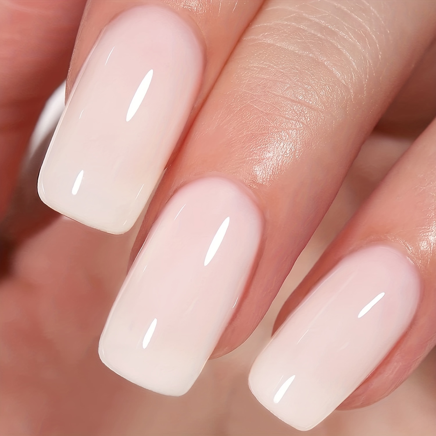 Nails design is in the form of square, color is natural pink, red and white.  A