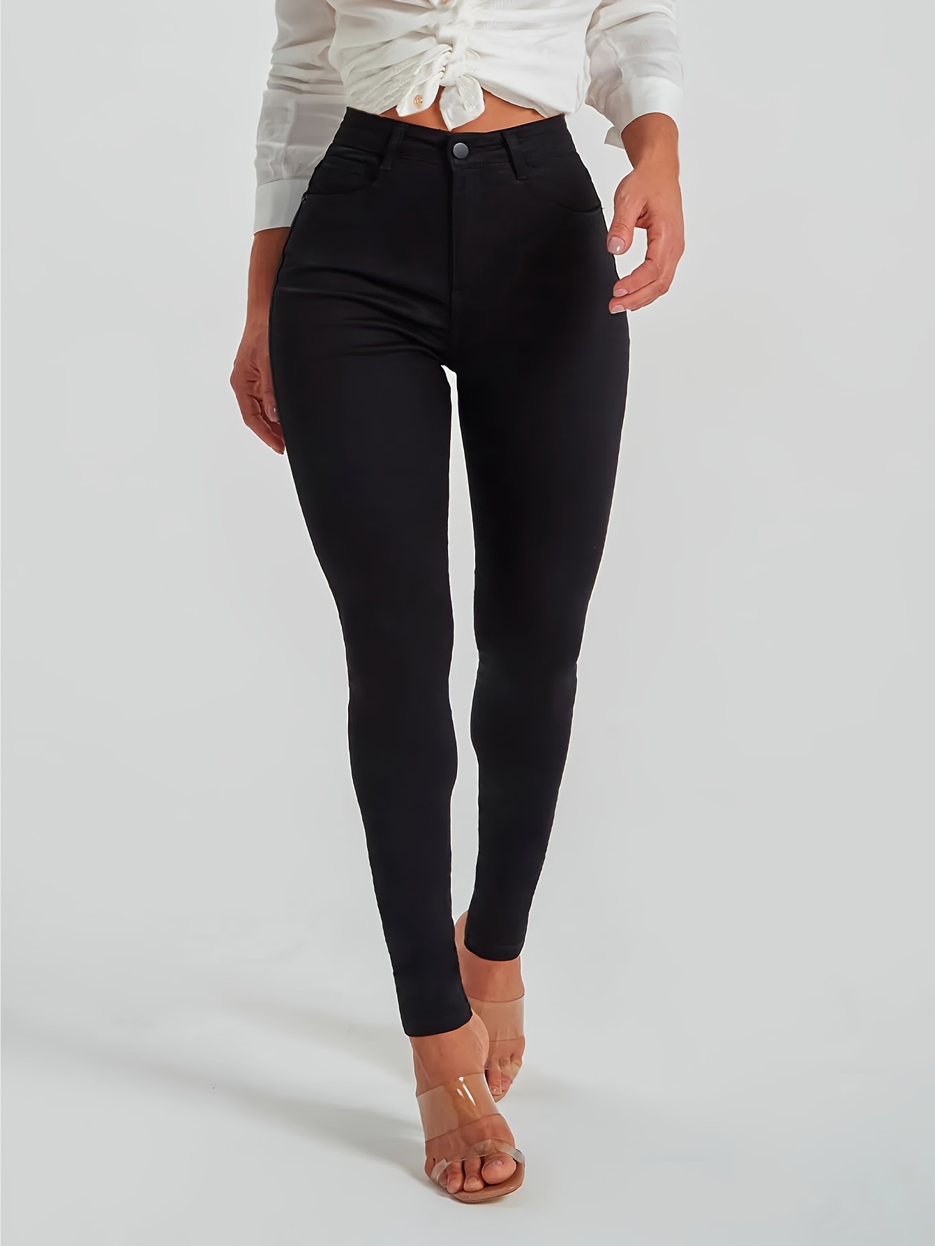 Pantalones vaqueros ajustados de color negro con dobladillo sin rematar de  tiro alto, diseño liso de cintura alta y pantalones vaqueros desgastados, p