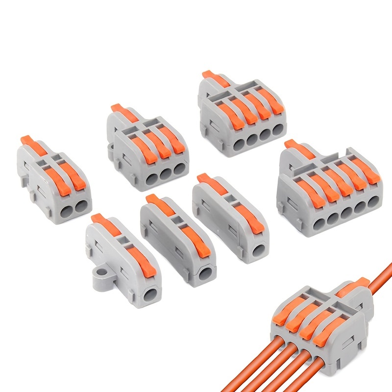 El electricista está fabricando una nueva caja de conexiones para cables  eléctricos con la ayuda de conectores de cables de empuje.