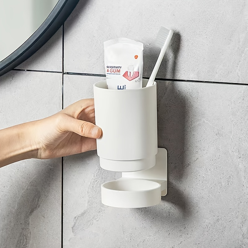 

1pc Bathroom Tumbler With Holder, Wall Mounted Mouthwash Cup, Punch-free Toothbrush Cup, Simle Plastic Gargle Cup, Bathroom Accessories