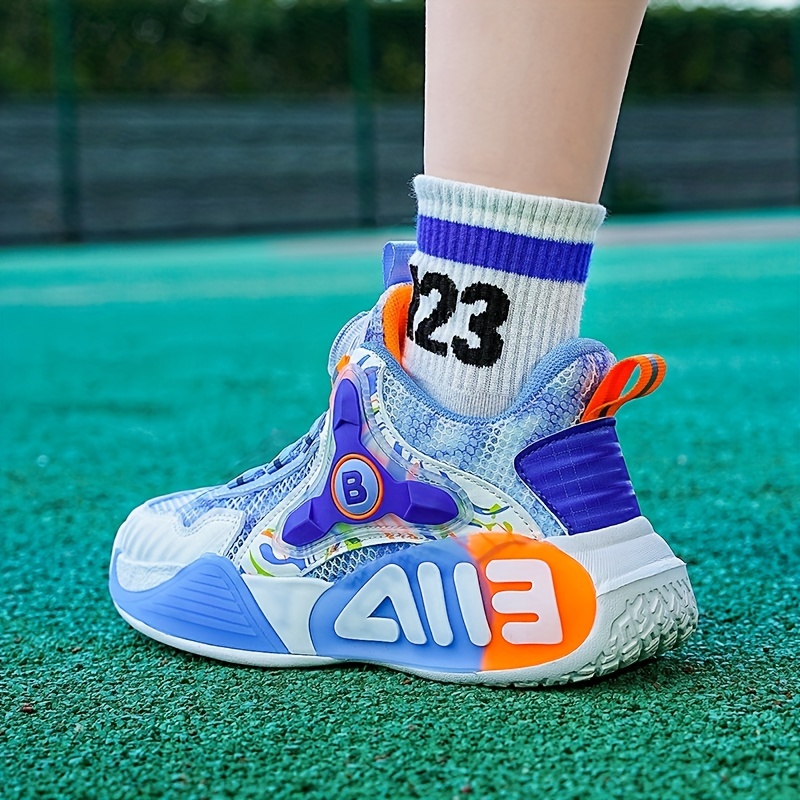 Zapatillas deportivas de baloncesto para niños con botón giratorio para niño  alto Botas de running de calidad para niños Escuela sin deslizamiento  Shoes31-40 - China Calzado deportivo y Zapatos de Sneaker para