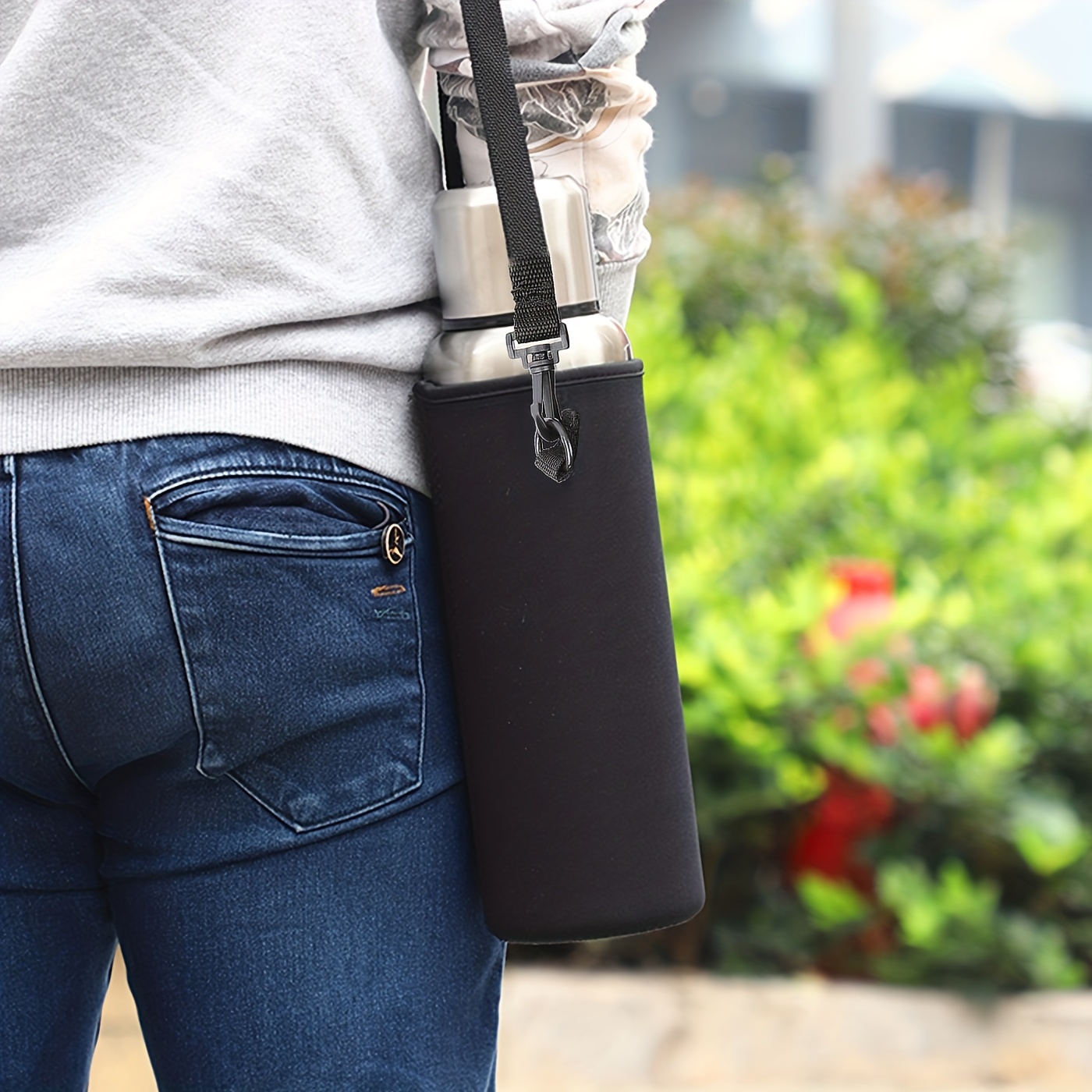 Leather water bottle holder with strap and glass bottle