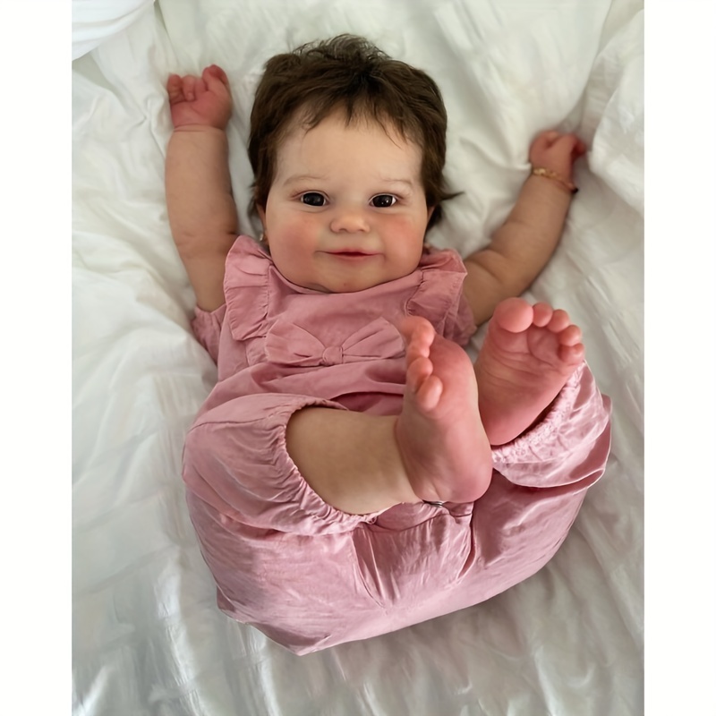 Cloth body best sale reborn dolls