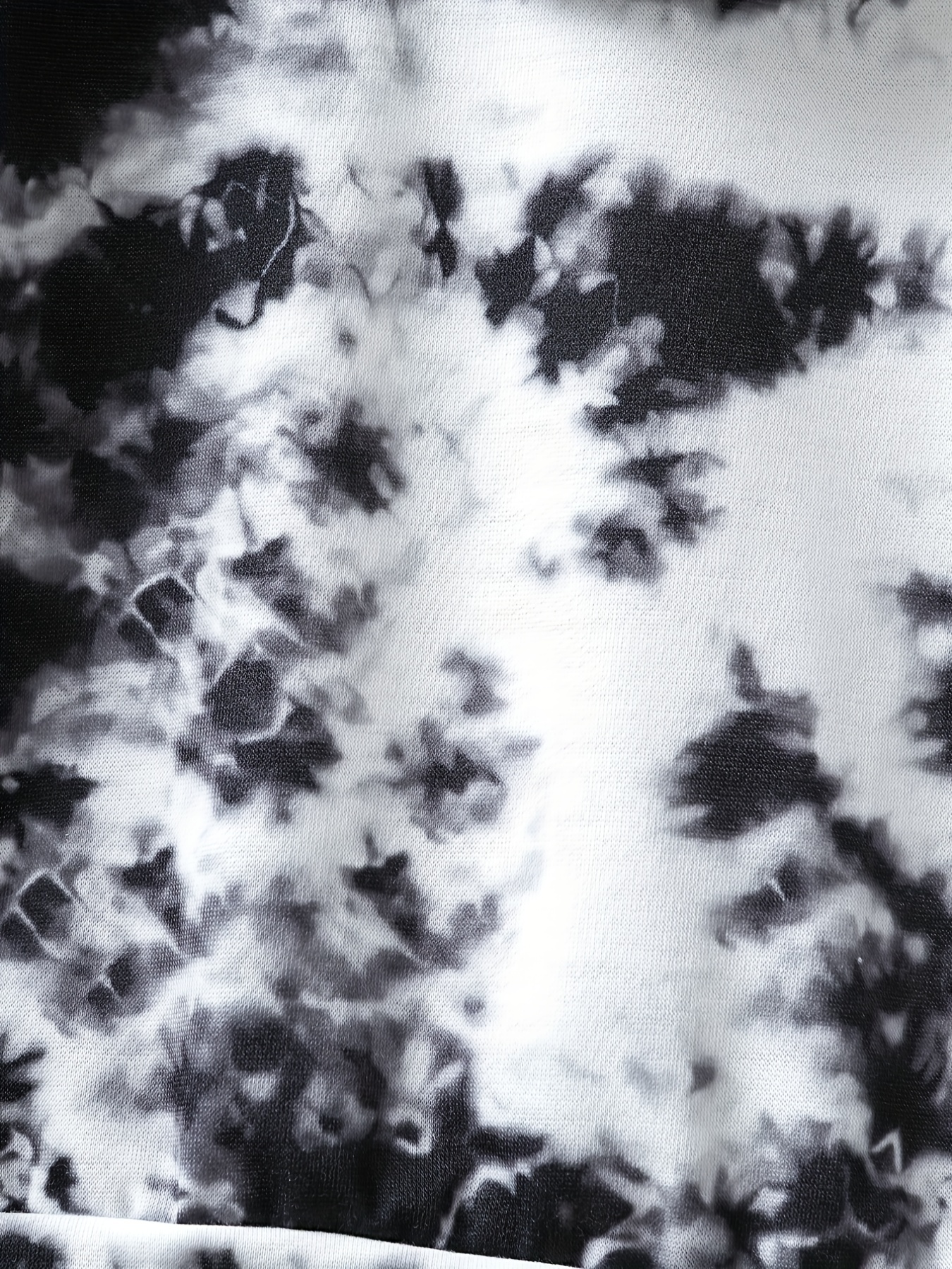 Black tie dye printed fabric on a white background – Couture et