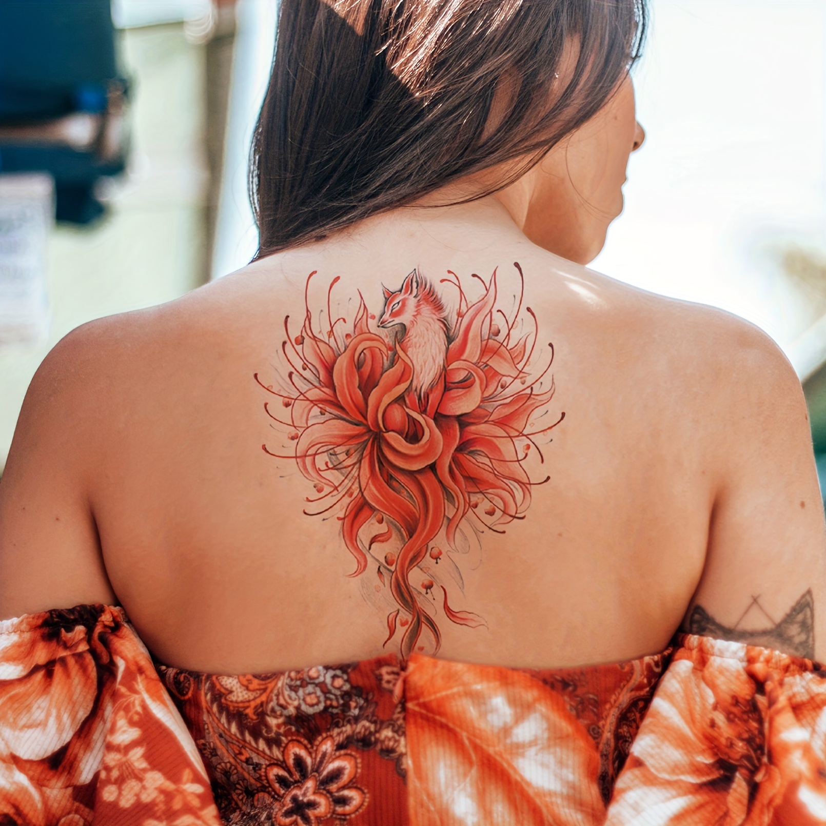 delicate back tattoos