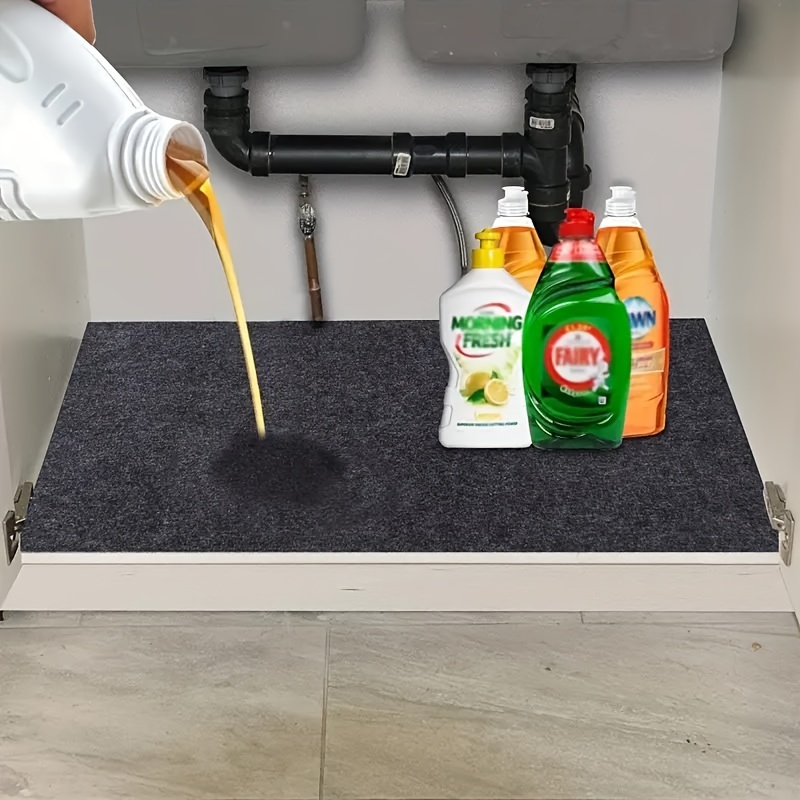 This Under-Sink Mat on  Makes Cleaning Under the Sink Easy