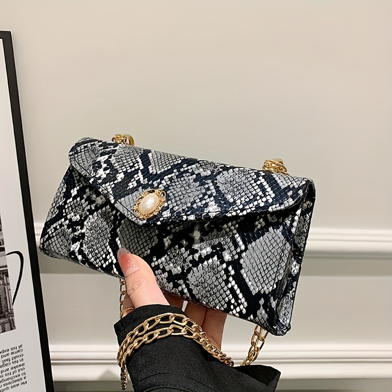 Snakeskin print 2024 clutch bag