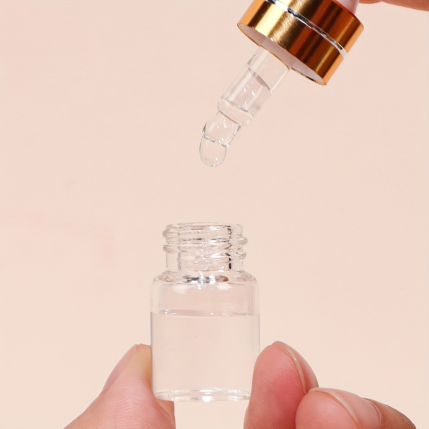 100個の2ml透明ガラススポイトボトル エッセンシャルオイル香水化粧品