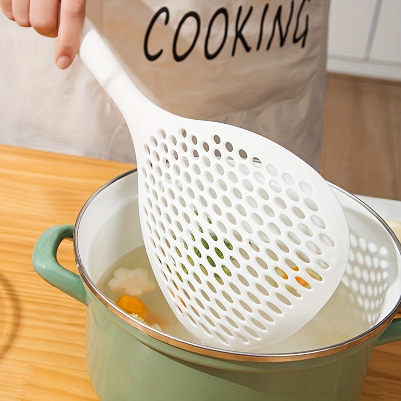 Unique strainer spoon for blanching and draining.