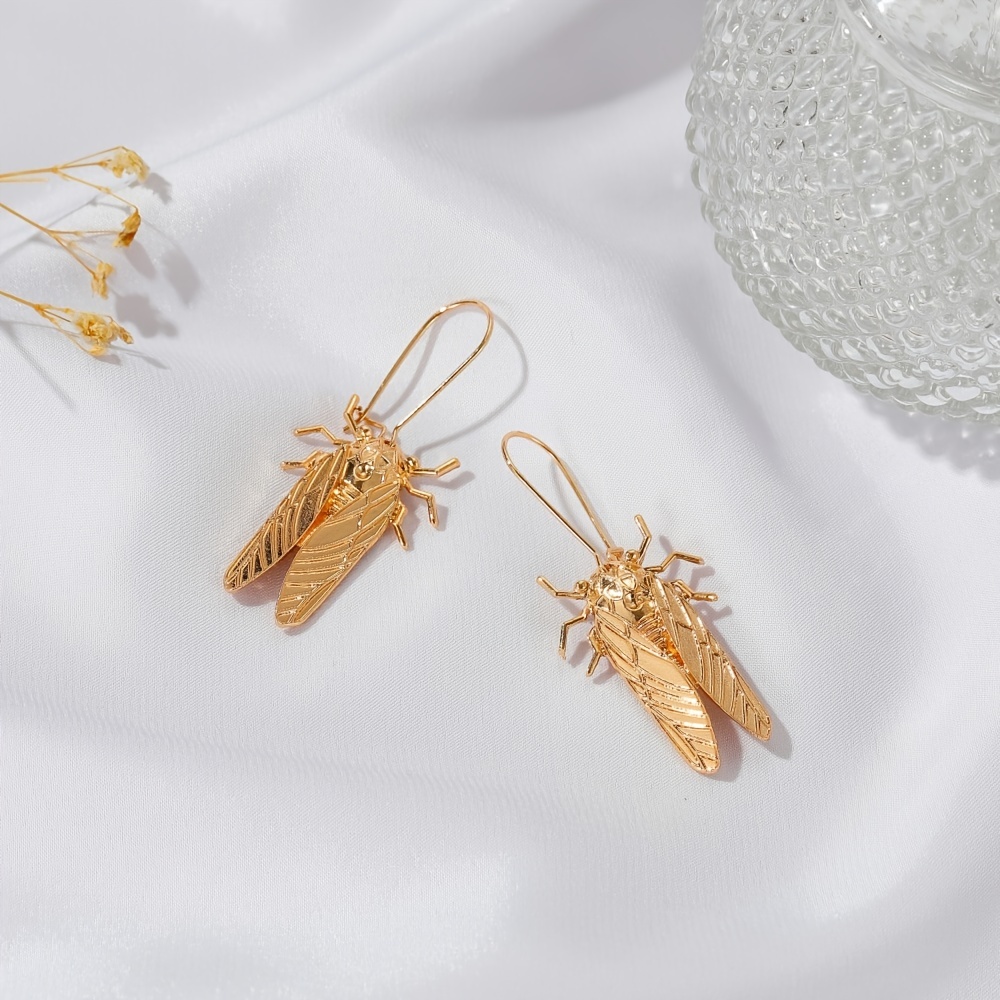 insect brand earrings lv