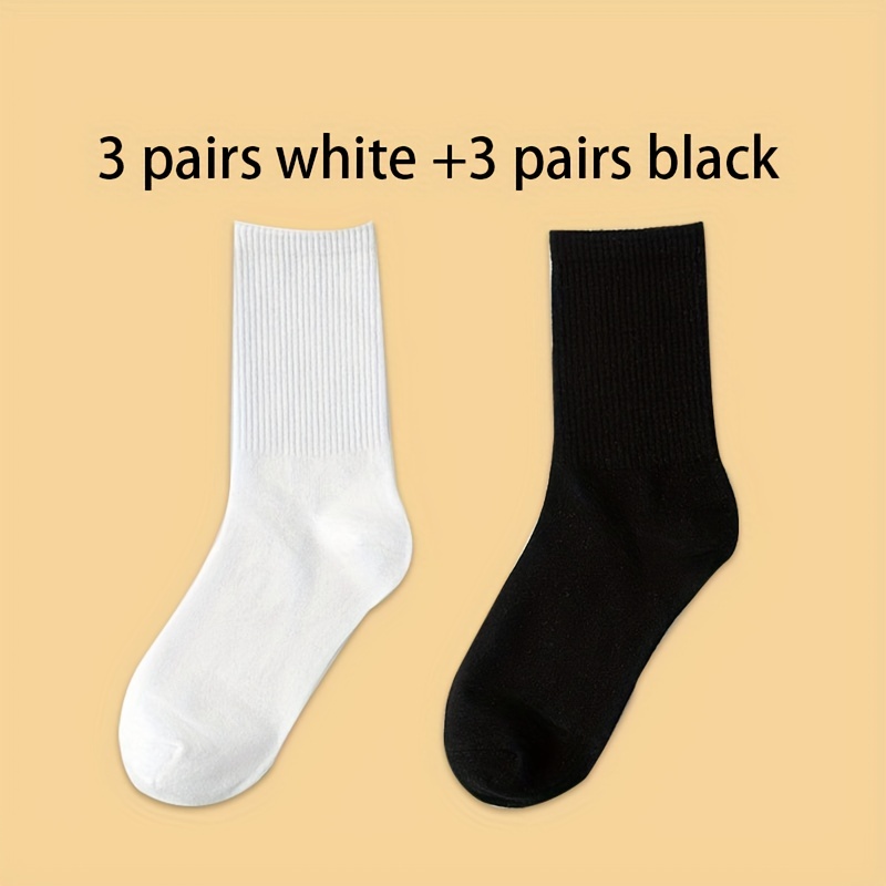 Juego de 5 pares de calcetines negros y blancos lisos.