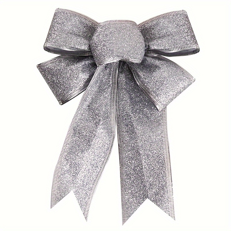 Colorful gift wrapping bows and silver sequins on white festive