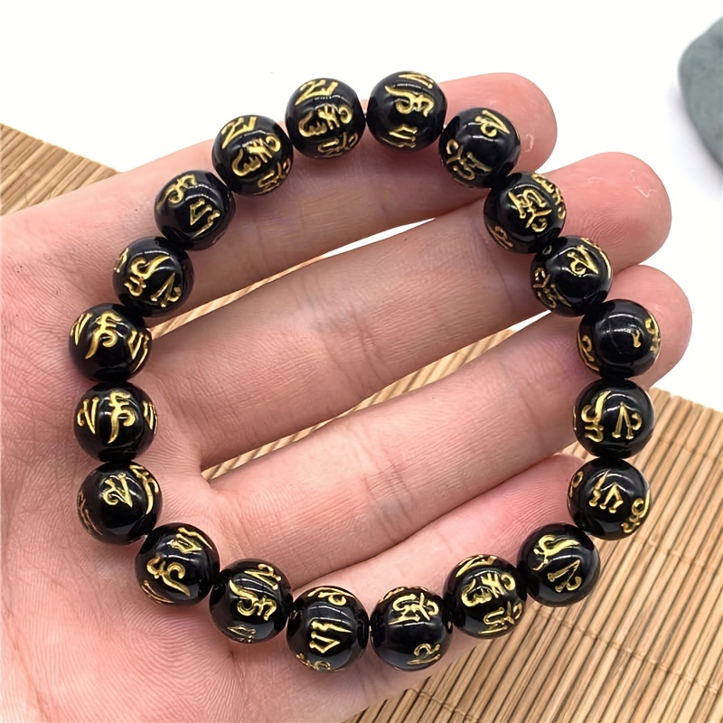 Black and gold store buddha bracelet