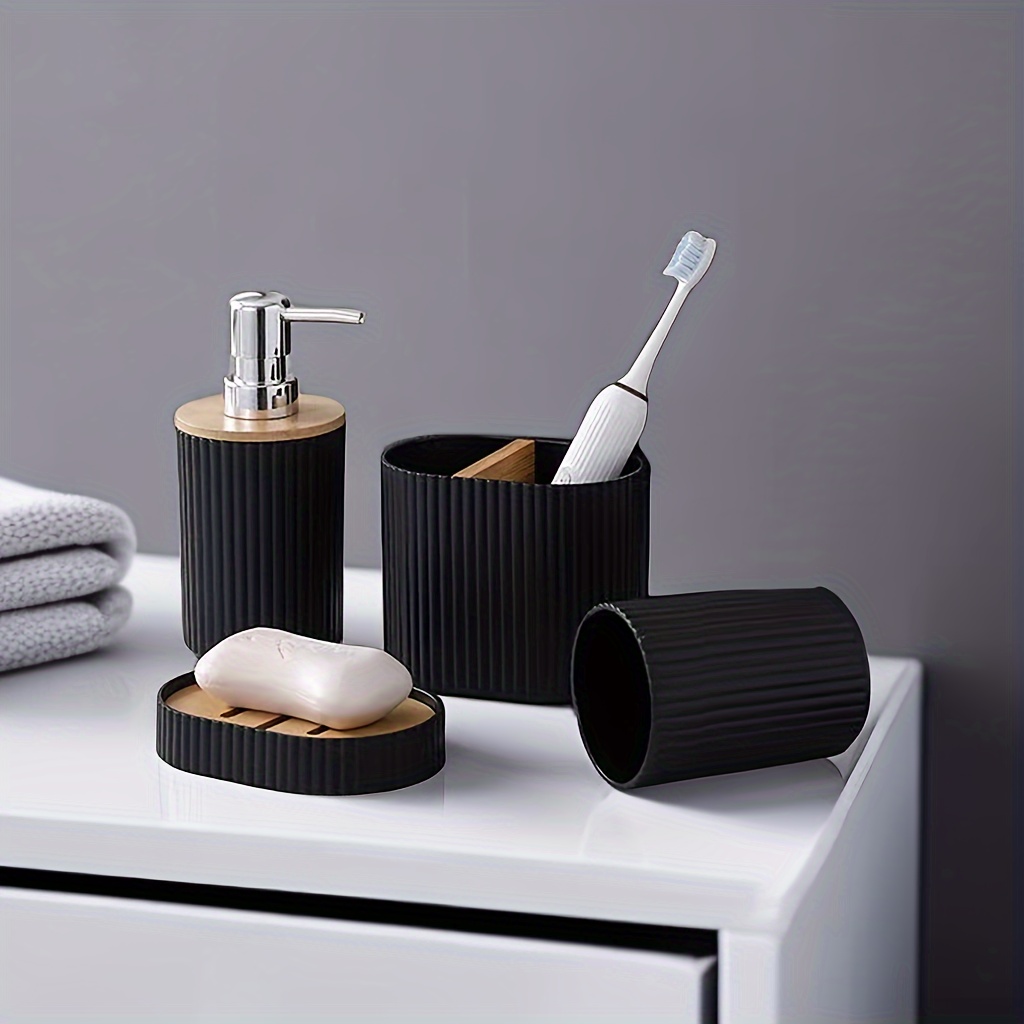 Juego de accesorios de baño de 4 piezas, color blanco y negro, incluye  dispensador de loción, soporte para cepillos de dientes y jabonera, acabado