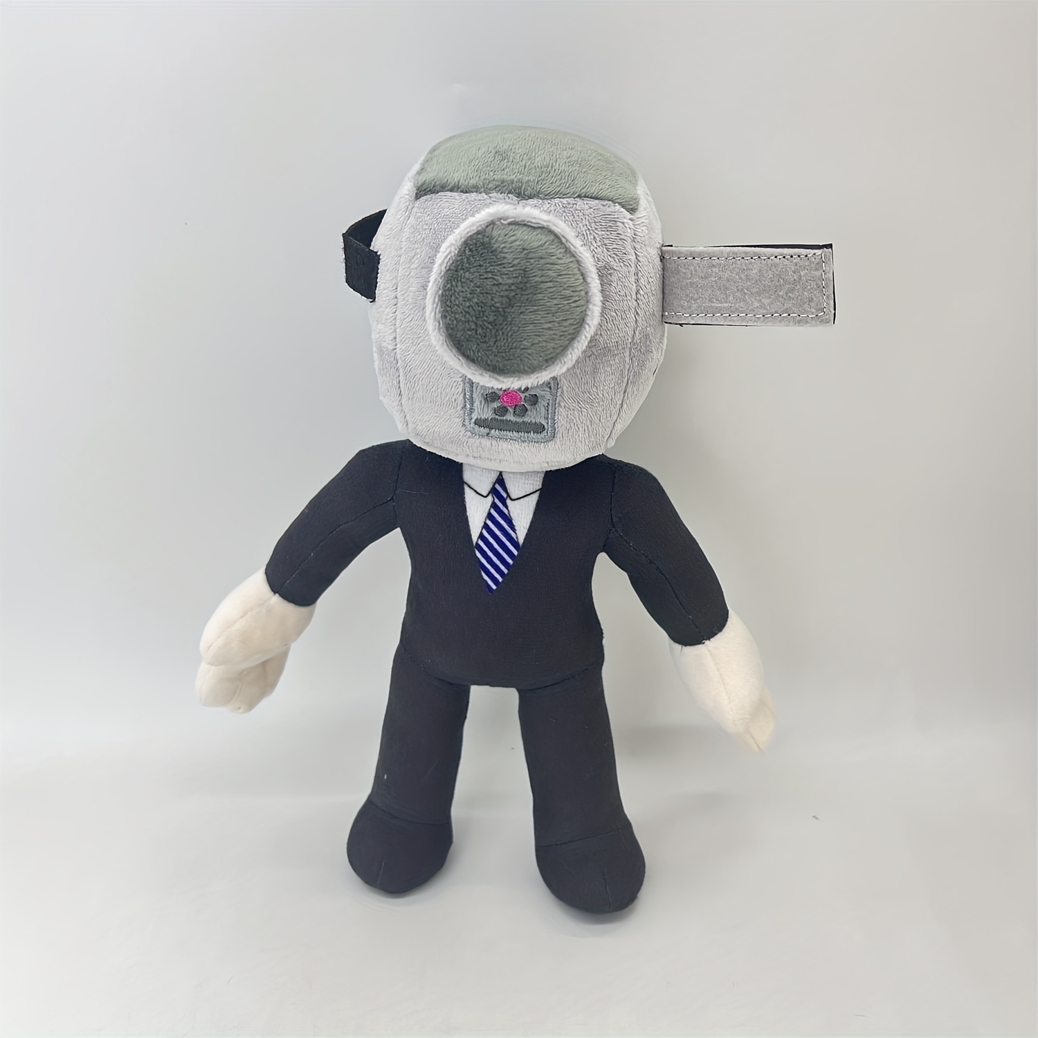 Skibidi Toilet Man Plush, Cameraman Plush Titan TV Man 9.84-inch Toys Funny  Smile Face Soft Stuffed Anime for Fans Kids Friends and Collectors