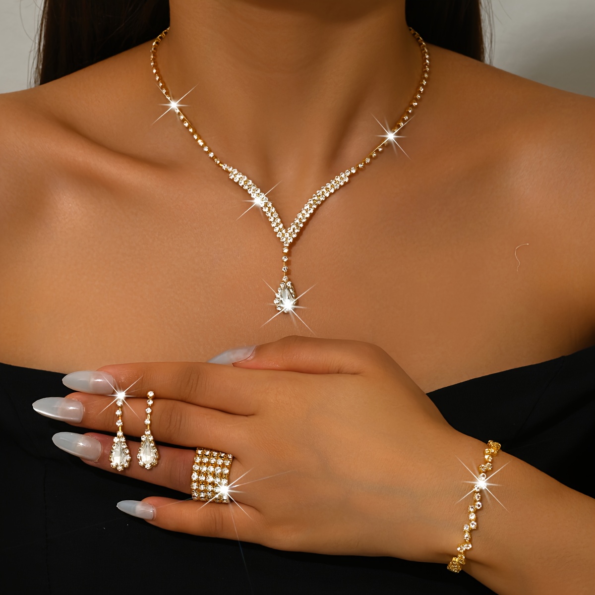 Image of Fashionable, Elegant, And Sexy Copper-inlaid Rhinestone Four-piece Set: Necklace, Earrings, Bracelet, And Ring, Perfect For Prom And Party Accessories