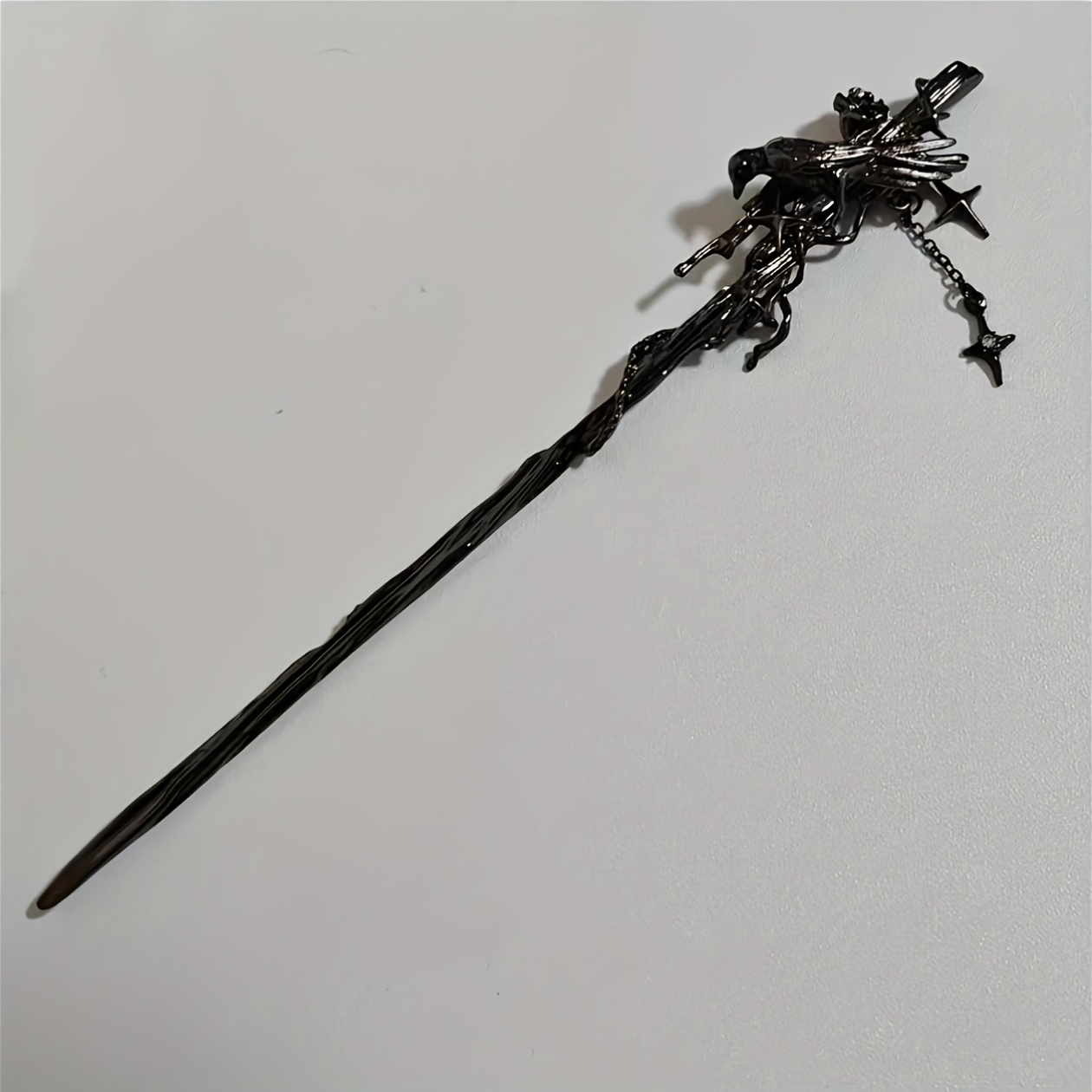 A Hairpin With A Niche Dark- Featuring A Sweet-, Dangling Tassels, And A Four-pointed Star. Model: S50