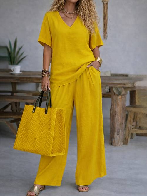 item picture womens casual two piece set featuring a solid color short sleeve shirt and wide leg trousers