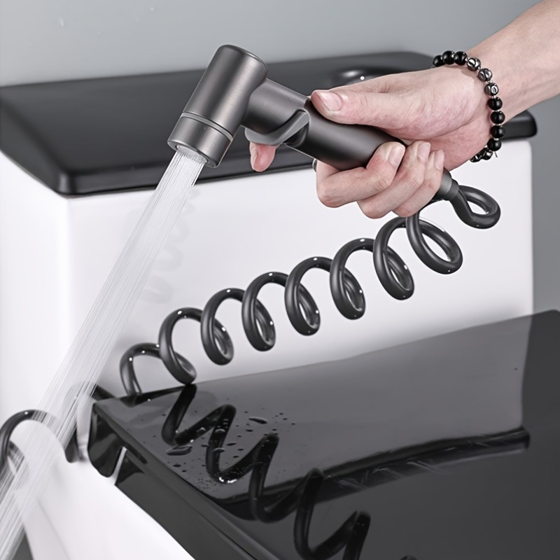 gray multifunctional handheld spray gun with   nozzle   cleaning bathrooms and flushing toilets