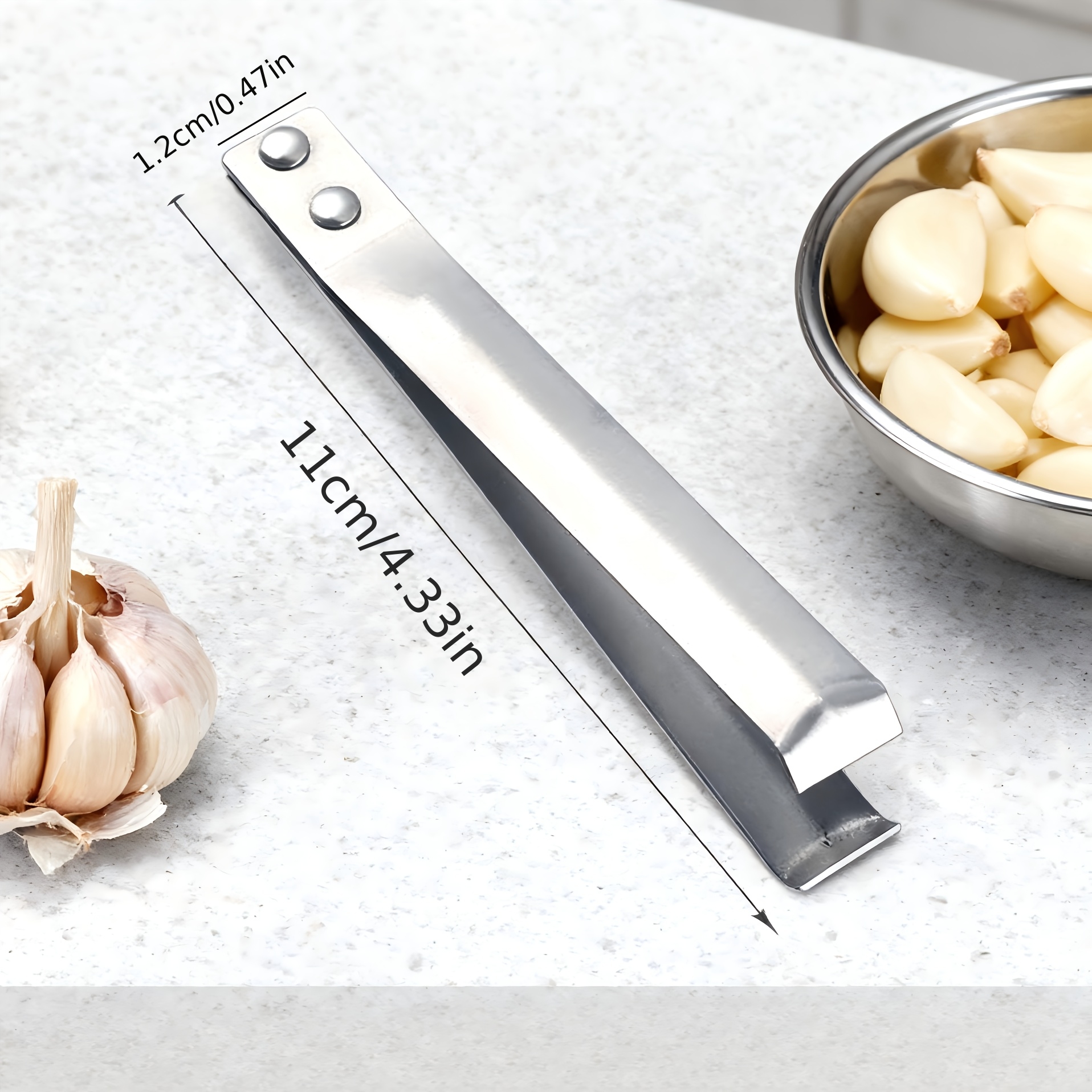 Multifunctional Stainless Steel Garlic Peeling Clip. It Allows You To Peel Garlic Quickly And Well . Designed With A Tweezer Clip, It Can Be Used For Removing Hair. A Really Practical Kitchen Item