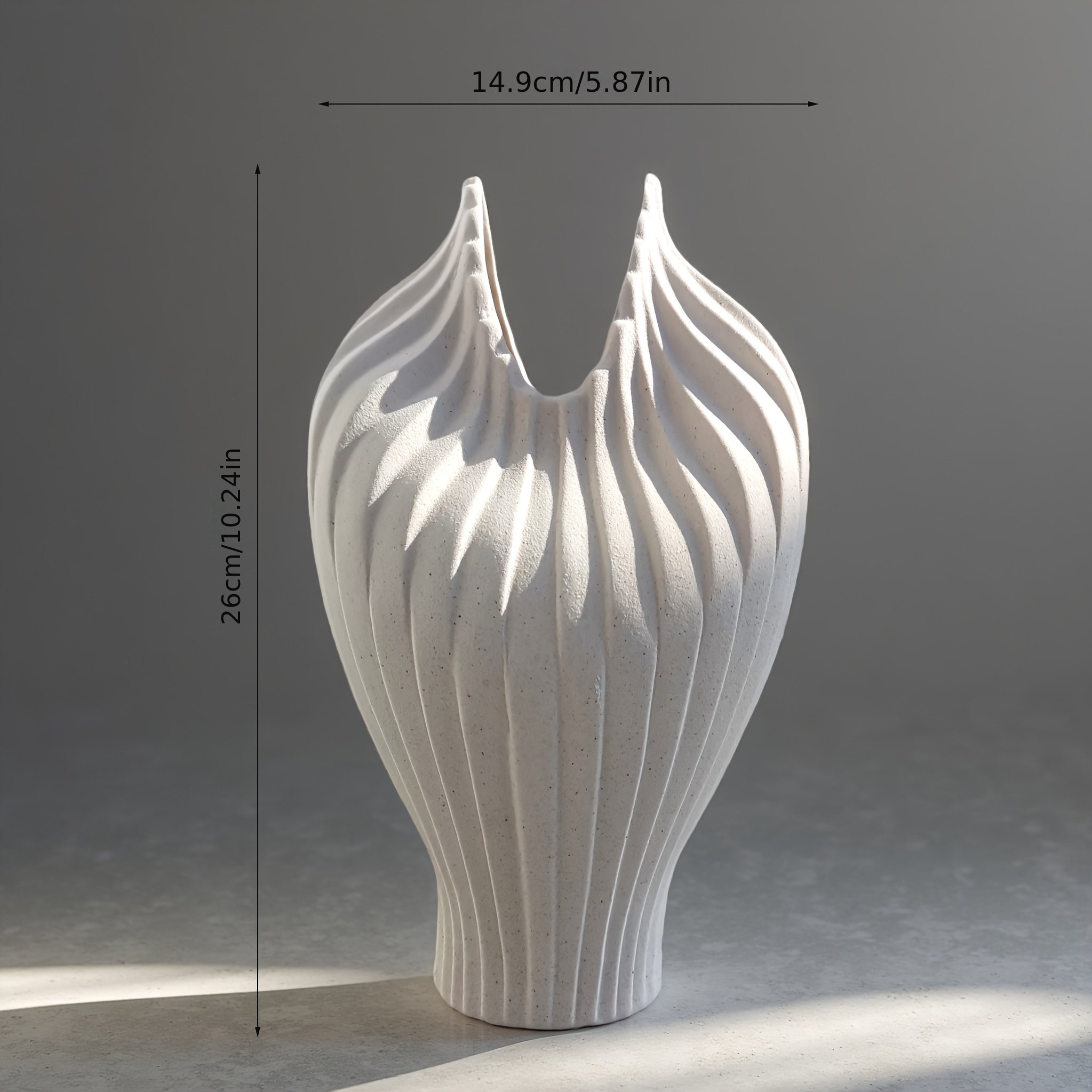 A Handcrafted Decorative Ceramic Vase with an Artistic Design Style, Featuring a Masterfully Designed Shape and Frosted Texture. Suitable for Decoration in Various Settings