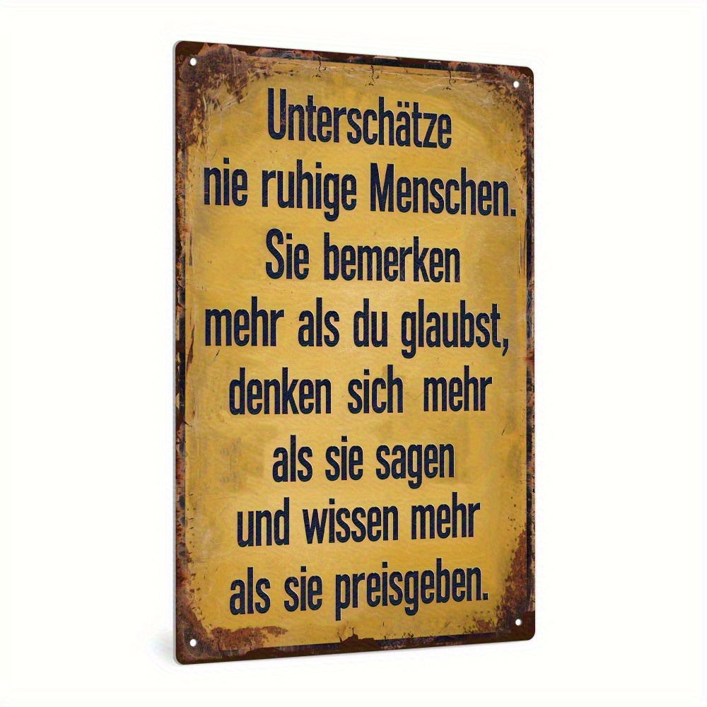 2d Flat - A Vintage German Quote Metal Sign That 'never Quiet People.' This Rustic Iron Wall Art Features A Weathered Yellow Background With Blue Text