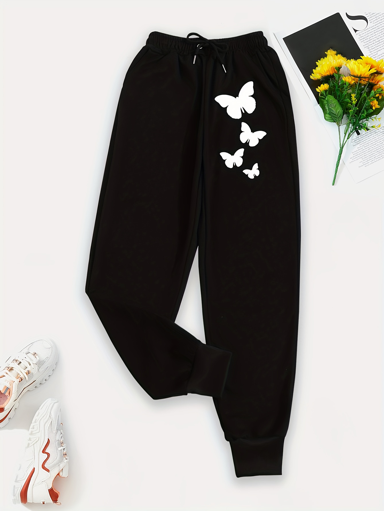 Black sweatpants with online butterflies