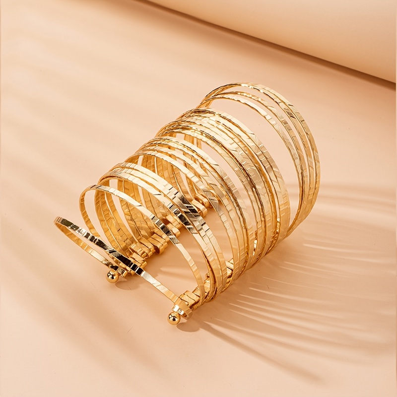 Fat gold clearance bangles designs