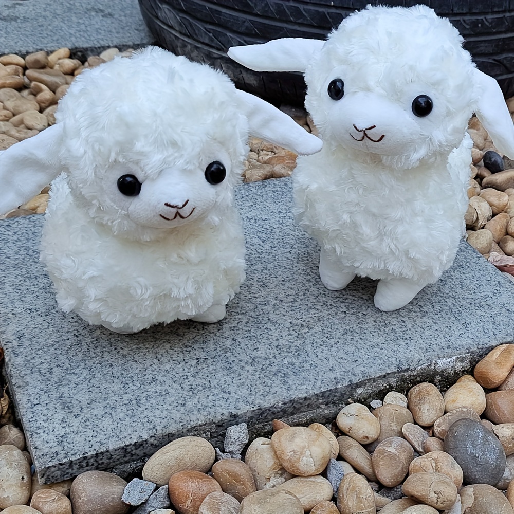 mouton en peluche avec laisse