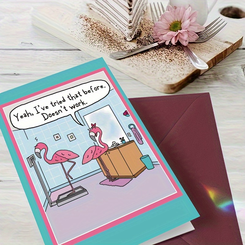 

2 Pink Flamingos In Of Greeting Card Are In The Blue Bathroom, With 1 Standing On A Weight Scale And The Other Standing Next To The Sink, Suitable For Giving To Family And