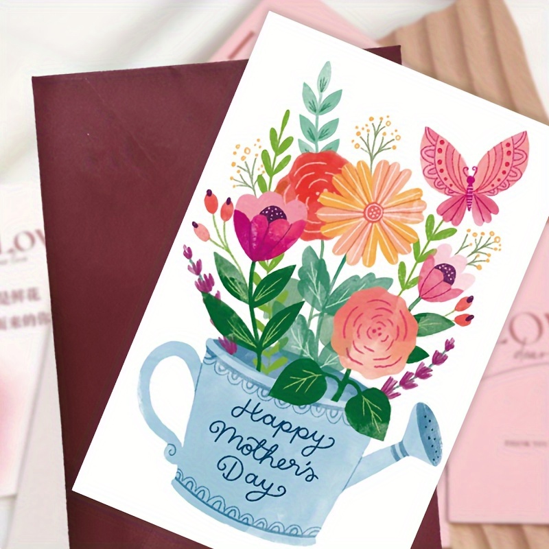 

1pc Mother's Day Greeting Card. The Blue Watering Can With The Words "happy Mother's Day" Is Filled With Various Flowers, And There Is Also A Pink Butterfly Next To It Suitable For Giving To Mothe