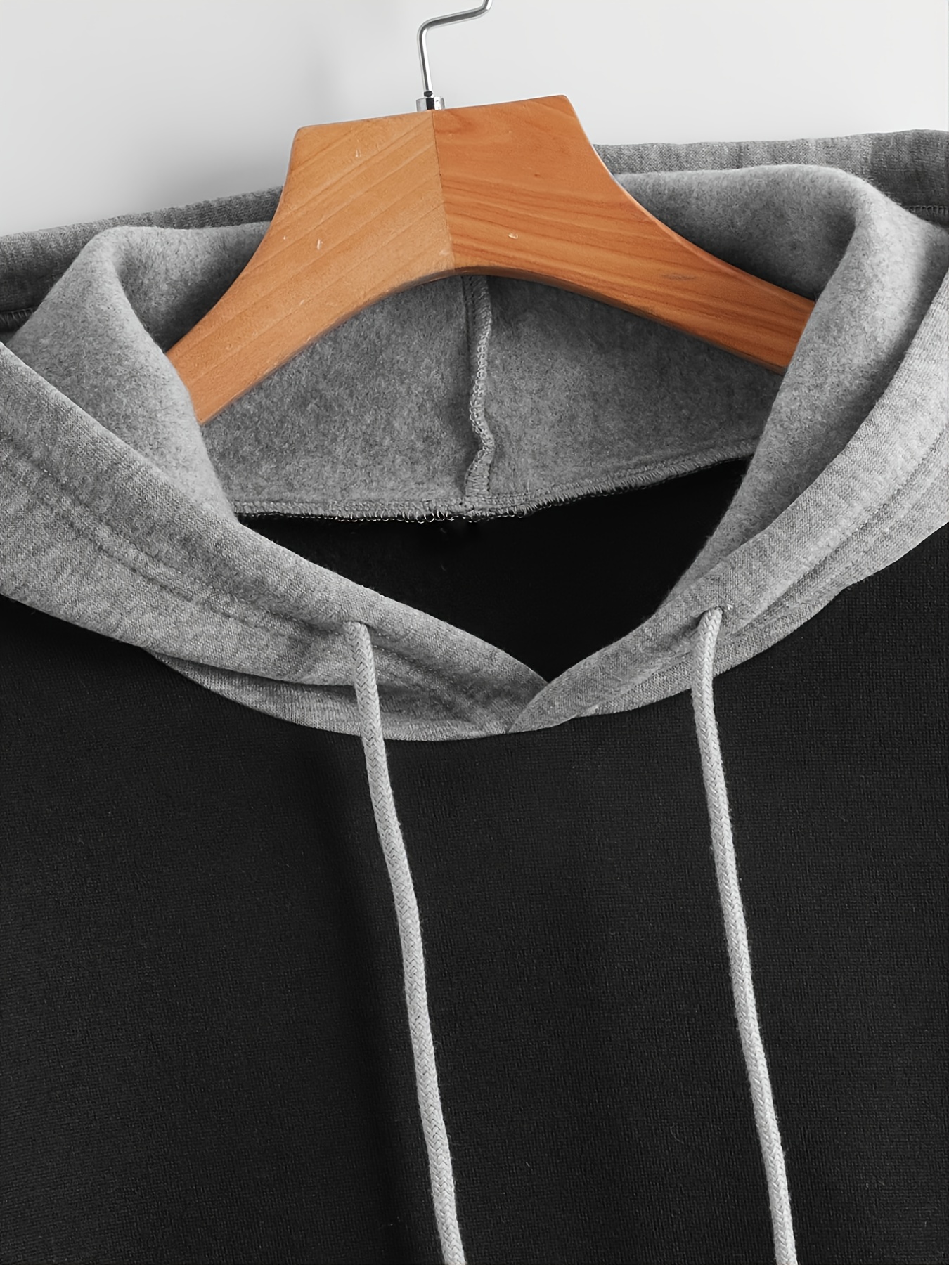 Plain black hoodie with white outlet strings