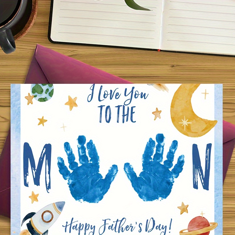 

1pc, Greeting Card Is A Hand Drawn Greeting Card That Mainly Displays 2 Blue Handprints, Surrounded By Various Celestial Bodies And Stars, Suitable For Giving To One's Own Father, Father's Day