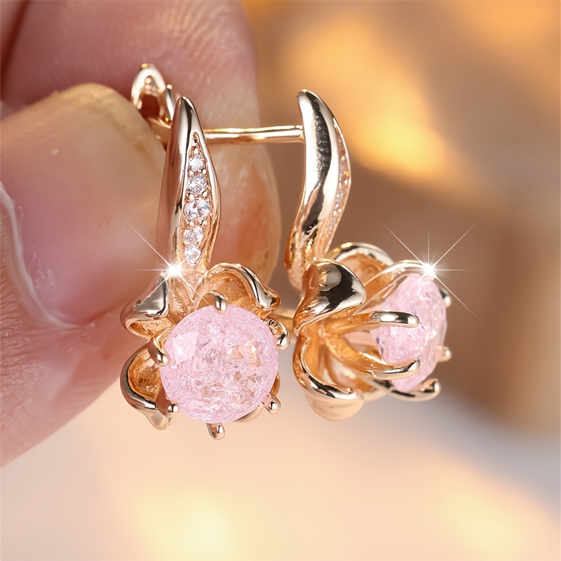 Image of A Set Of Earrings Featuring Round-cut Pink Synthetic Zirconia Stones In A Design, Perfect For Weddings Or As Gifts