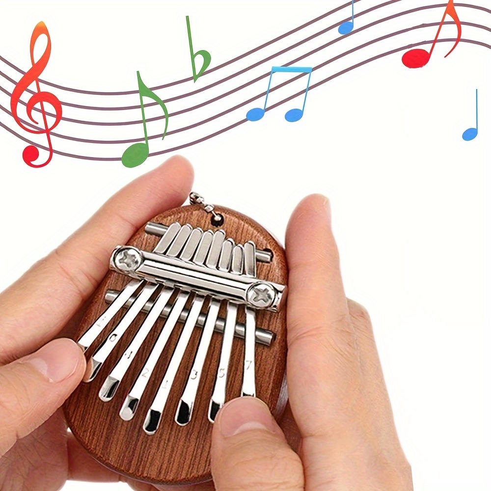 

Mini Kalimba à 8 Touches - Cadeau pour les de la Musique, Idéal pour les Anniversaires, Noël, Halloween et Thanksgiving