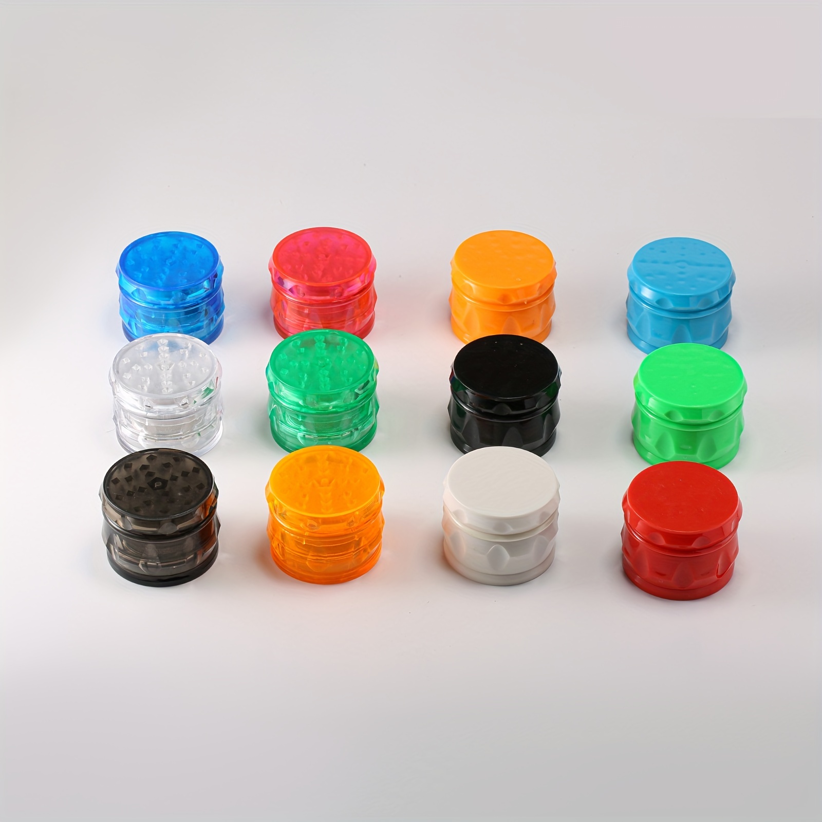 multi colored drum shaped plastic cigarette grinder suitable for   easy to carry and manually   no electricity needed durable and stylish design suitable for tobacco suitable for home or office use perfect smoking tool