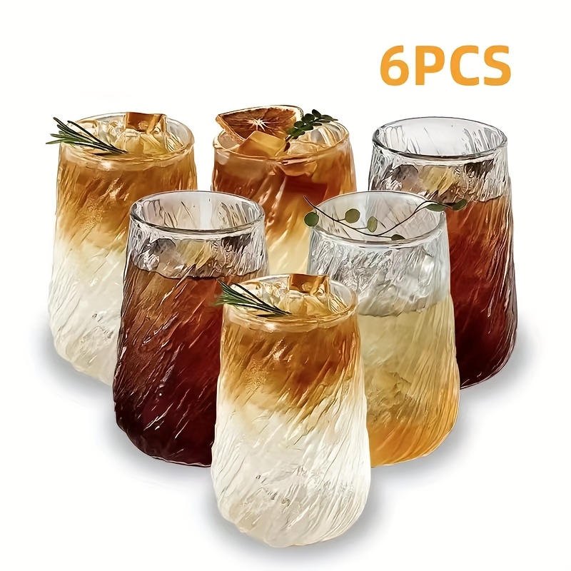 E-shop Ein Set aus sechs Glaswaren im Tornado-Stil, bestehend aus 420 ml/14,3 oz Cocktailgläsern, geriffelten Bierkrügen, Kaffeetassen,