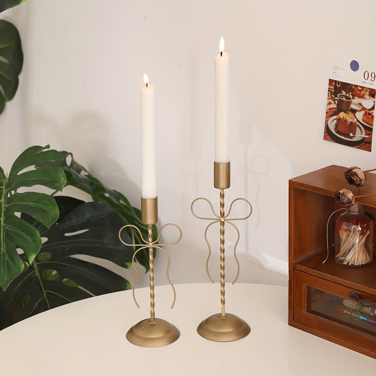 a   bow candle holder suitable for pillar candles a decorative piece with a unique shape and an elegant atmosphere ideal for weddings or parties made of durable metal that resists deformation   as tabletop d cor in dining rooms Product details 1