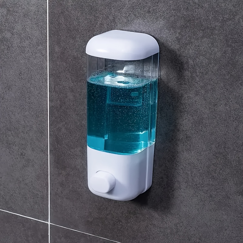 

A Soap Dispenser That Mounted On The Wall, Plastic Without Mercury, And Operates Manually Without Electricity For Dispensing Liquid Soap In Kitchens And Bathrooms.