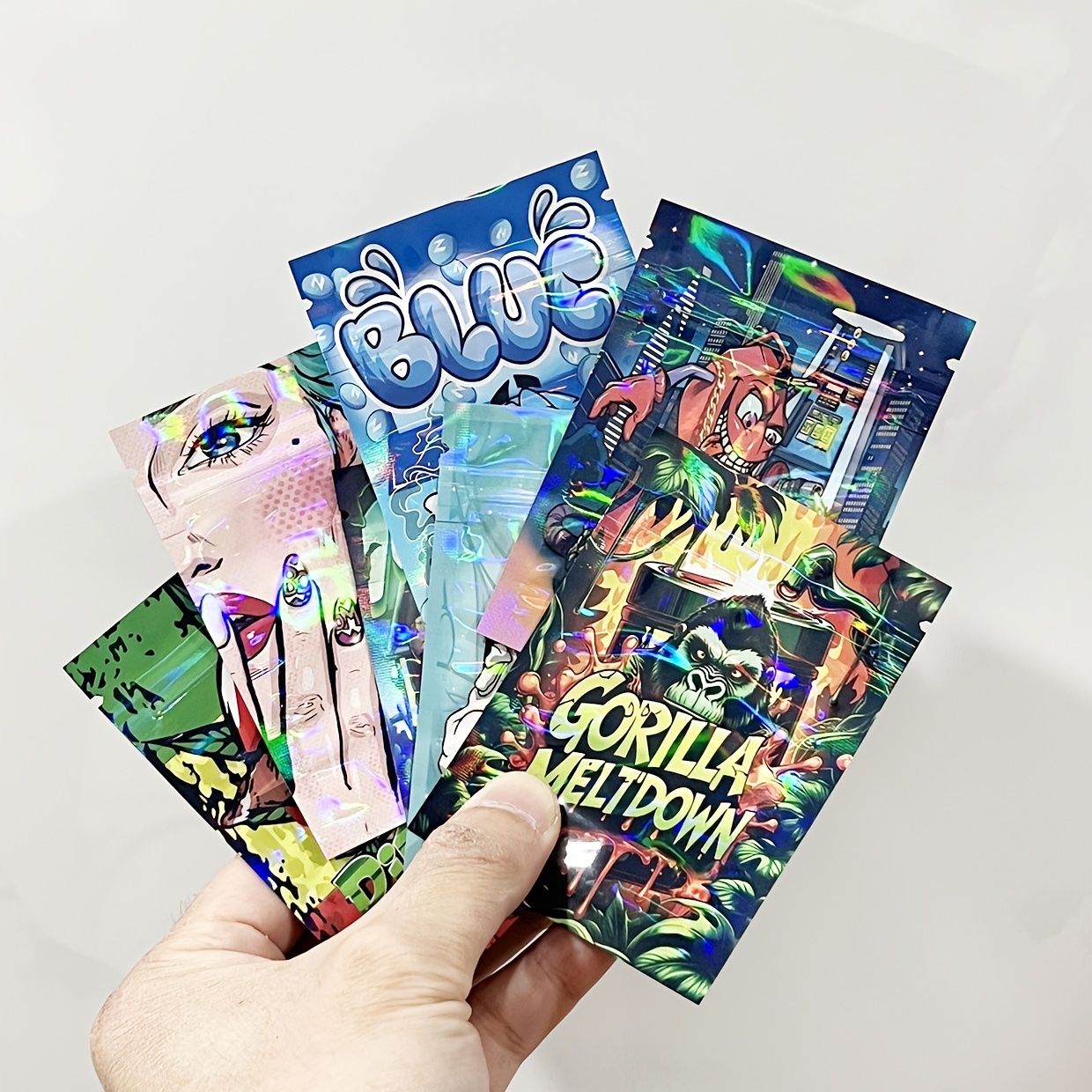Paket 100 holografskih Mylar vrečk - 1G neprepustne za vonj, ponovno zaprtljive vrečke s prozornim okencem, lasersko sijoč PE material za