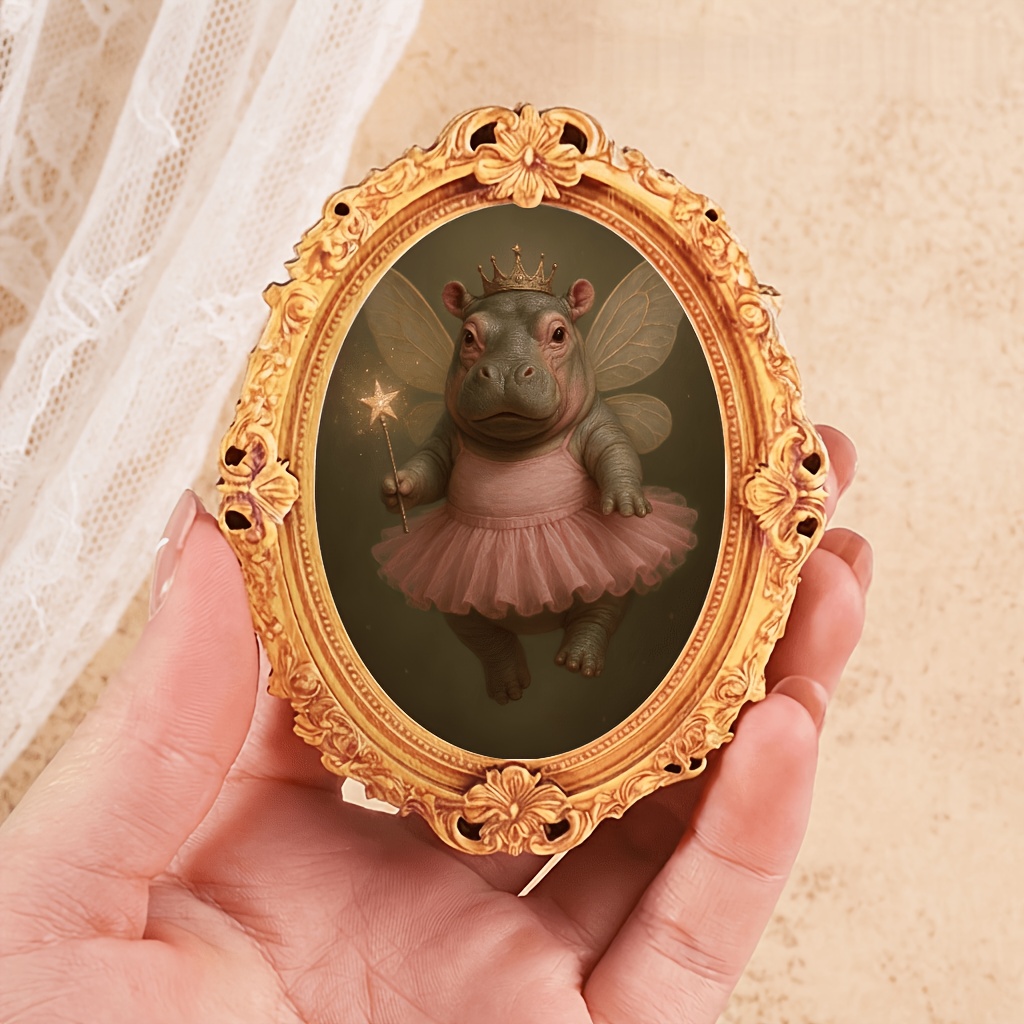 TEMU 1 Oval Wooden Fridge Magnet Featuring A Vintage Oil Painting-style Elf Hippopotamus. The Wears A Small , A Pink Ballet Tutu, And Has Light Wings