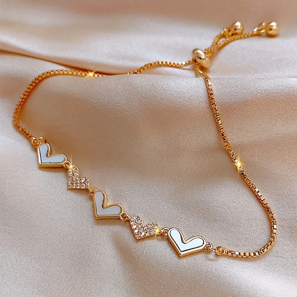 

A Stylish And Elegant Metal Bracelet With Heart-shaped Rhinestones, Perfect As A Valentine's Day Present Or A Gift For A .