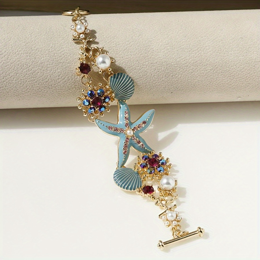 One gorgeous starfish pendant bracelet with shell details and sea coral beads suitable for beach daily wear and ocean vacation style