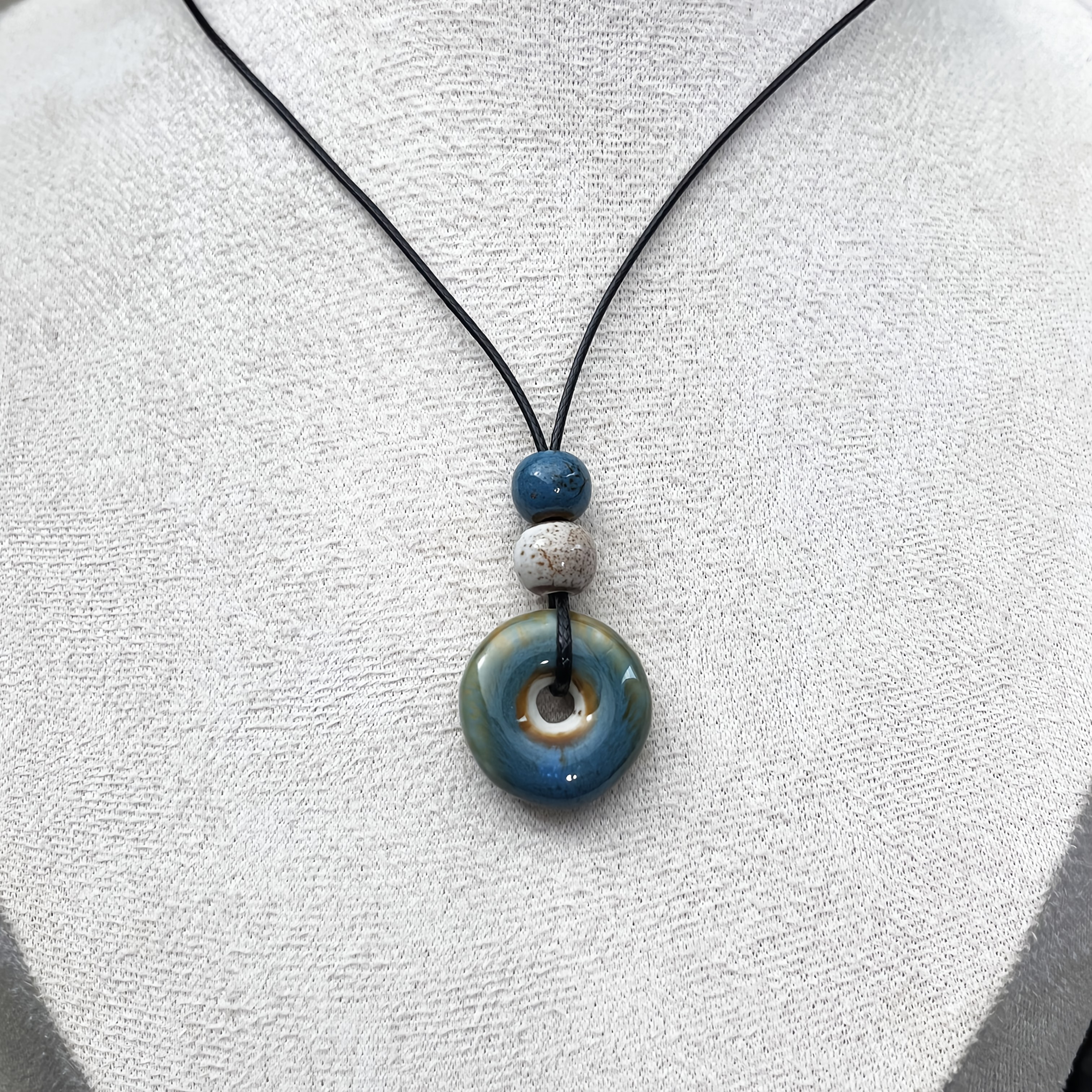Image of Handmade Ceramic Charm Pendant Necklace - Bohemian Style July Birthday Stone Jewelry, With Blue Beads, Natural Wood Grain Beads And Black Ropes, Suitable For Casual Outfits, Vacations And Gifts