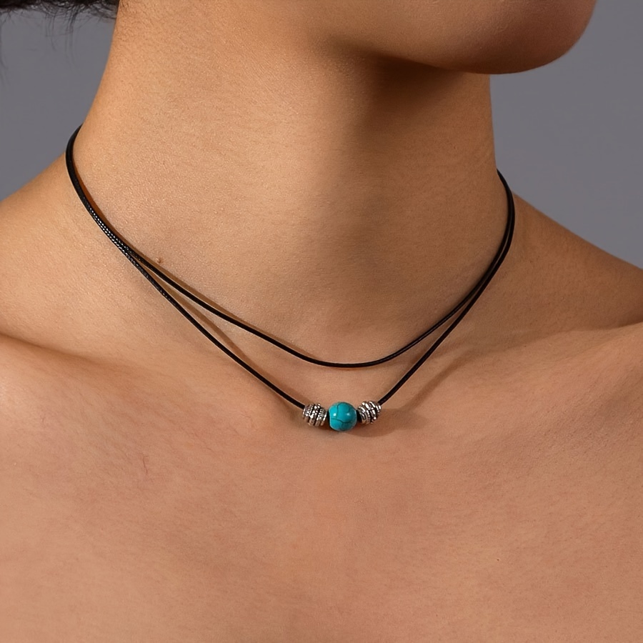 

Collier pendentif en turquoise verte à double couche de style bohémien avec cordon en cire, adapté pour un usage quotidien et en vacances