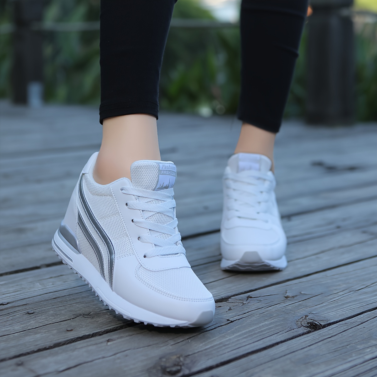 White ladies wedge sneakers sold by 100 Spartans