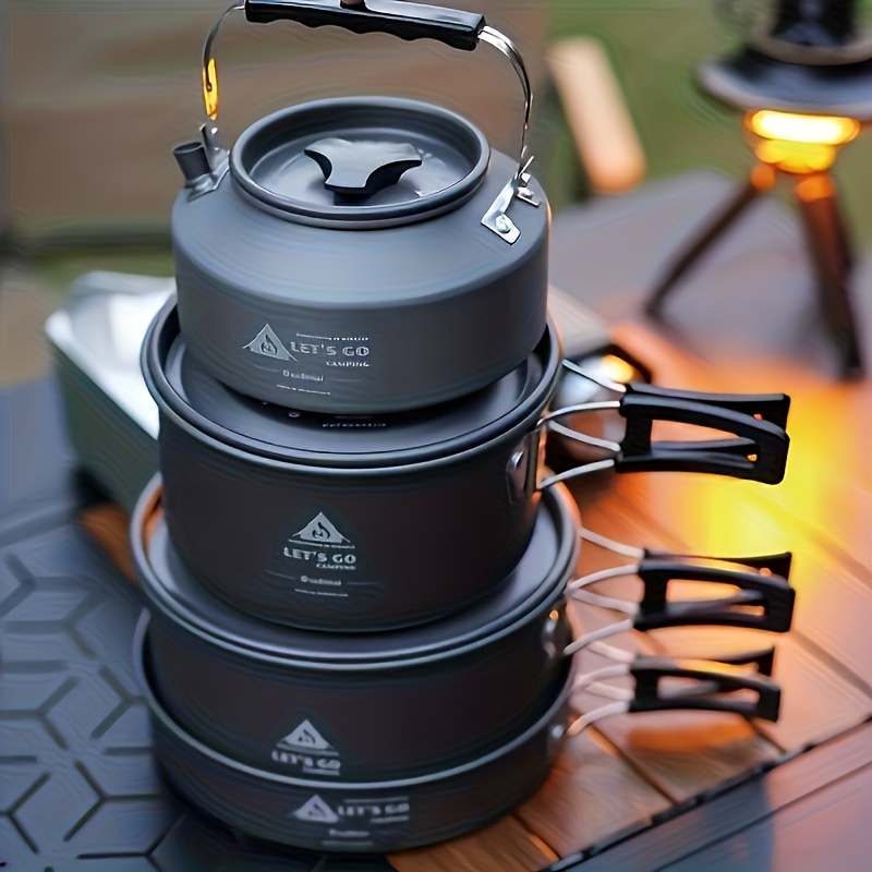 the   cookware set is designed for outdoor cooking for 3   featuring a portable combination pack   easy to carry and space saving it   a frying pan kettle and collapsible storage along with bowls a wooden spatula